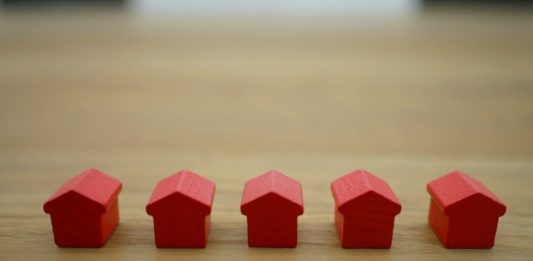 Top Mistakes to Avoid When Filing a Homeowners Insurance Claim red blocks on brown wooden table