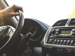 How Field Sobriety Tests Can Be Challenged In Court Close-up of a hand on a steering wheel inside a car, dashboard visible.