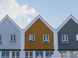 Why Some Housing Markets Stay Strong in Economic Downturns white and brown concrete house under blue sky during daytime