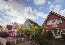 Why Investors Are Targeting Aging Properties for High ROI Renovations green trees near red and white house under blue sky during daytime