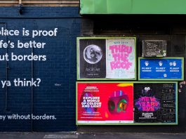 Why Street Posters Still Capture Attention in Busy Cities posters mounted on building wall during daytime