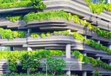 How to Navigate the Process of Accessing Net-Zero Retrofit Rebates gray concrete building covered trees