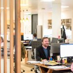 The Surprising Details That Make or Break First Impressions in Business a man sitting at a desk in an office