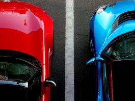 Smart Parking Isn’t Just for Tech Campuses Anymore top view photo of red and blue convertibles on asphalt road