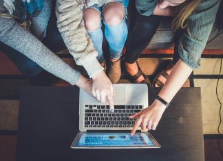 What Is a Handicap Bet, and How Does It Work? three person pointing the silver laptop computer