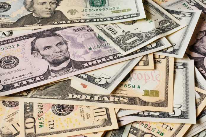 Photo by Alexander Schimmeck 10 and 20 us dollar bill