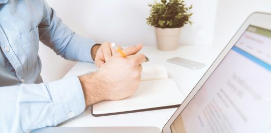 6 Things Insurance Companies Don’t Want Nevada Accident Victims To Know person writing on white notebook