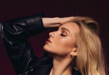 Why are our Mayfair Escorts Redefining Domination Services? a woman in a leather jacket posing for a picture