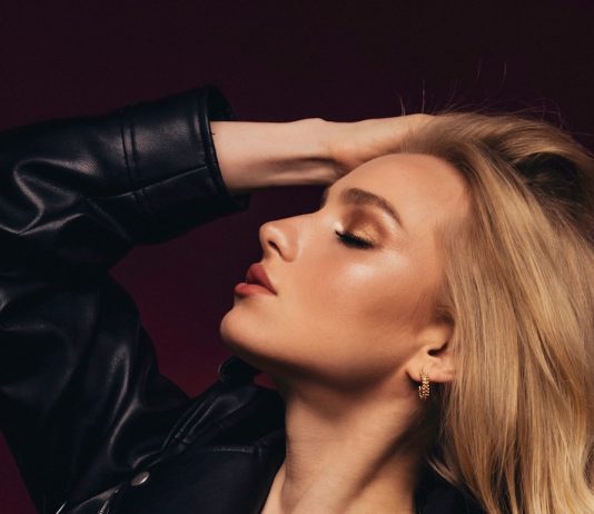 Why are our Mayfair Escorts Redefining Domination Services? a woman in a leather jacket posing for a picture