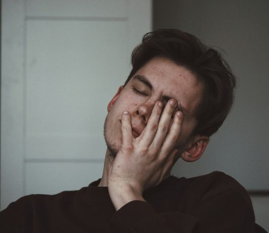 When Headaches Are More Than Just Stress man wearing black crew-neck top