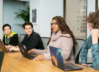 What to Do If Your Employer Disputes Your Workers’ Compensation Claim people in a group discussing app development