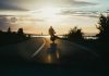 Maximizing Compensation After a Motorcycle Accident: New York Legal Strategies Silhouette of a motorcyclist riding on a scenic road during a beautiful sunset, emphasizing freedom and adventure.