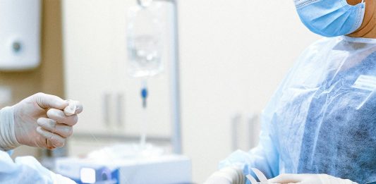 Medical Errors: Your Rights as a Patient Healthcare professionals in protective gear engaged in a surgical procedure.