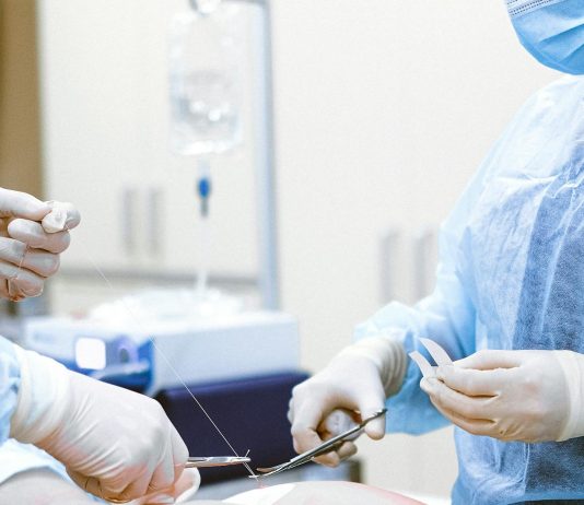 Medical Errors: Your Rights as a Patient Healthcare professionals in protective gear engaged in a surgical procedure.