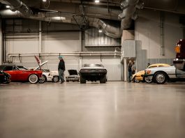 What Every Car Enthusiast Should Know Before Buying from an International Auction a man standing next to a row of parked cars
