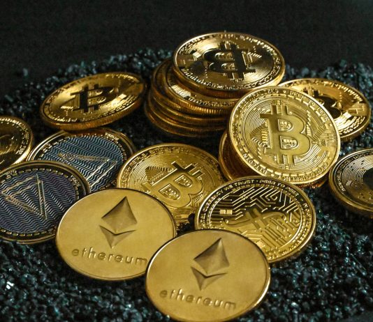 How BYDFi Puts Users First: Revolutionizing Crypto Trading With Innovative Features a pile of bitcoins sitting on top of a pile of gravel