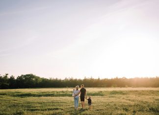 Creating A Lasting Legacy For Your Family man and woman walking on green grass field during daytime