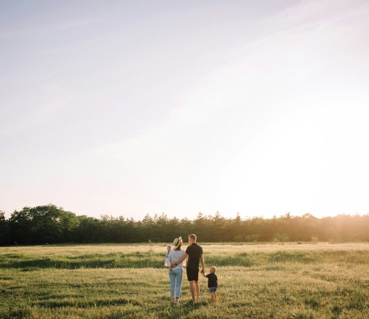 Creating A Lasting Legacy For Your Family man and woman walking on green grass field during daytime