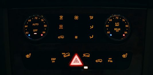 From Engine Trouble to Smooth Rides: Solving Problems Before They Grow Dashboard controls of a vehicle illuminated at night.