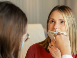 Are Nasal Sprays Enough to Treat Chronic Sinusitis — or Do You Need Surgery? a woman in a red shirt and a woman in a white shirt