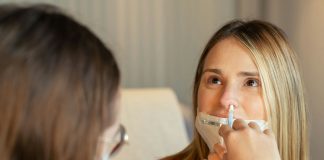 Are Nasal Sprays Enough to Treat Chronic Sinusitis — or Do You Need Surgery? a woman in a red shirt and a woman in a white shirt