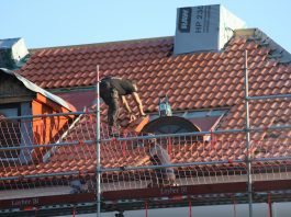 5 Most Popular Certifications In The Roofing Industry A man on a roof working on a roof