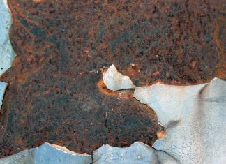 Legal Requirements for Disclosing Material Latent Defects a piece of metal that has been rusted