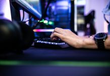 Enjoygm—Gamers’ New Choice for Cheaper Top-Up a person is typing on a laptop computer