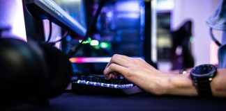 Enjoygm—Gamers’ New Choice for Cheaper Top-Up a person is typing on a laptop computer