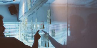 5 Warning Signs Your Business Continuity Plan Needs an Update person pointing white paper on wall