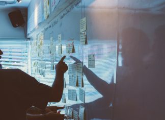 5 Warning Signs Your Business Continuity Plan Needs an Update person pointing white paper on wall