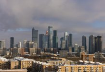 Nav Int and the Commitment to Exceeding Client Expectations Every Time Modern skyscrapers dominate a winter cityscape with snow.