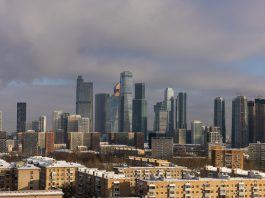 Nav Int and the Commitment to Exceeding Client Expectations Every Time Modern skyscrapers dominate a winter cityscape with snow.