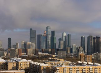 Nav Int and the Commitment to Exceeding Client Expectations Every Time Modern skyscrapers dominate a winter cityscape with snow.