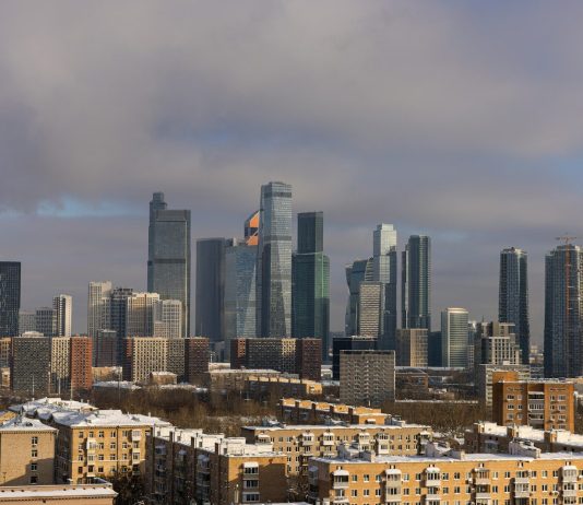 Nav Int and the Commitment to Exceeding Client Expectations Every Time Modern skyscrapers dominate a winter cityscape with snow.