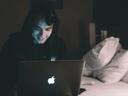 Why Crash Games Have The Buzz But Slots Still Dwarf Them By Scale person using MacBook in bed