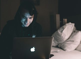 Why Crash Games Have The Buzz But Slots Still Dwarf Them By Scale person using MacBook in bed