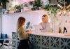 Practical Ways to Make a Local Business Look More Established woman facing on white counter