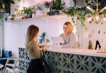 Practical Ways to Make a Local Business Look More Established woman facing on white counter