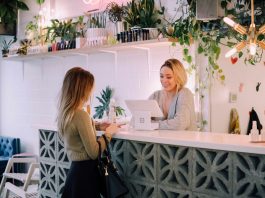 Practical Ways to Make a Local Business Look More Established woman facing on white counter