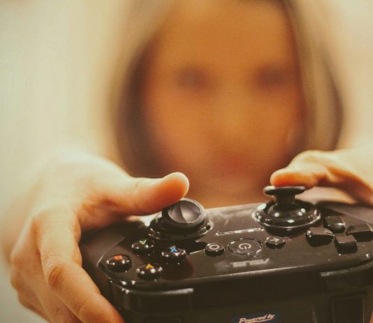 How Digital Gaming Communities Are Growing Worldwide person holding black sony ps 4 controller