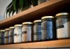 A Simple Checklist for Choosing Storage Jars from a Furniture Store in Coimbatore a shelf filled with lots of different types of spices