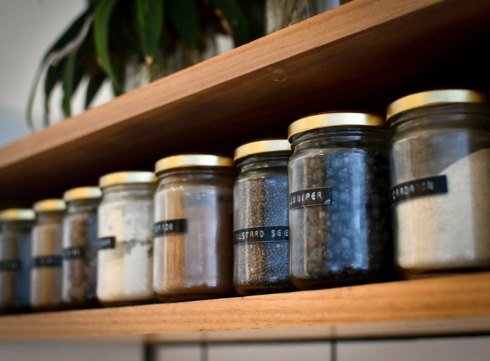 Photo by Heather McKean a shelf filled with lots of different types of spices