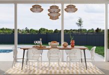 How To Match Your Home Layout To Your Lifestyle a dining room with a table and chairs next to a pool