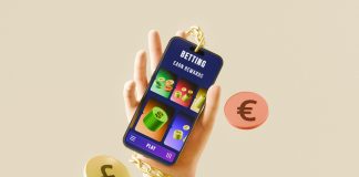 Why Betting Feels Better With The Right App Hand holding phone with betting app, currency, and gold chain.