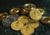 Best Crypto Cards in 2026: How to Compare Fees, Funding and Availability a pile of bitcoins sitting on top of a pile of gravel