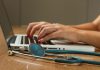 Professional Indemnity Insurance for Doctors: Protection Against Medico-Legal Risks person sitting while using laptop computer and green stethoscope near